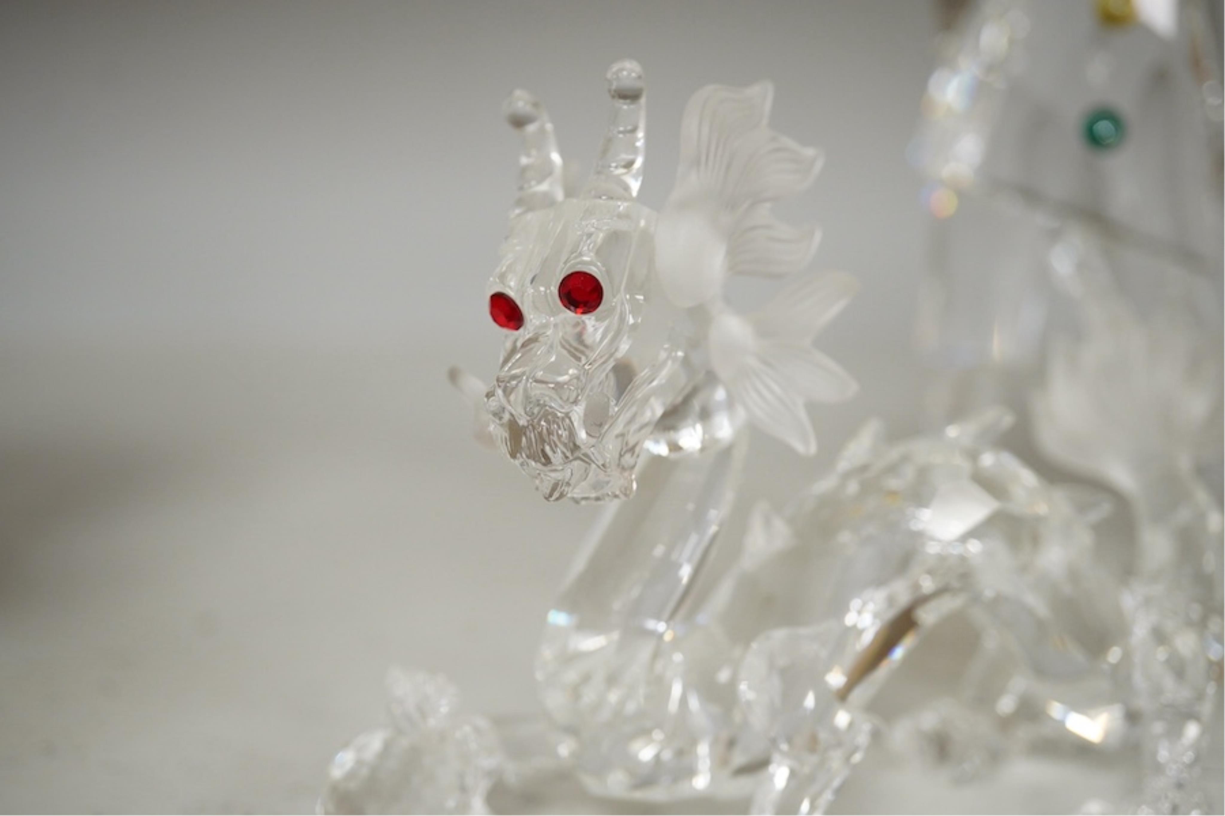 Five Swarovski crystal figures including Masquerade Columbine, Masquerade Harlequin, Masquerade Pierrot, a Chinese Dragon and Pegasus. Condition - good